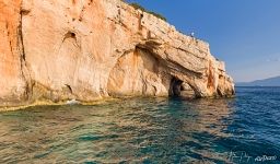 Entrance of the Blue Caves at the foot of Skinari and Potamitis Windmills