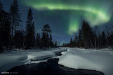 Northern lights over a non-freezing river